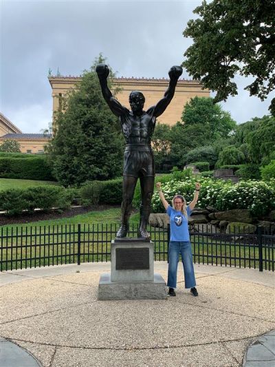 A group of teachers take a selfie in front of the US Capitol.